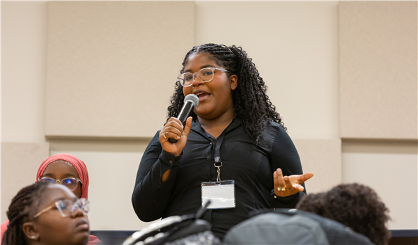 Image of student talking through microphone