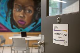 Image of the Community Lounge and a mural by artist Danilo Deluxo.